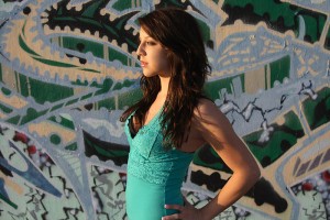 Briana moves away from the wall to get a contrasty look to the image.