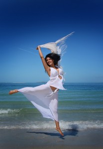 Vanessa jumping on the beach at Bean Point