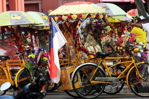 Decorated bikes for hauling tourists through the hot streets of Malaka