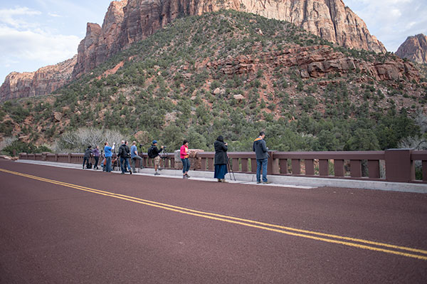 Photographers gathering on the bridge over the Virgin River at the mouth of Zion Canyon. Some times of the year find this bridge nearly impassable for the tripods and photographers!